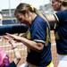 Natalie Harper interacts with utility player Katie Luetkens in the dugout on Saturday, May 4. Daniel Brenner I AnnArbor.com